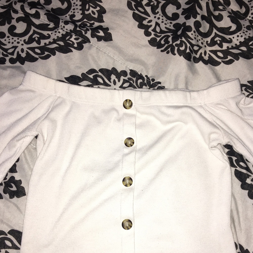 I am selling a white crop top with buttons